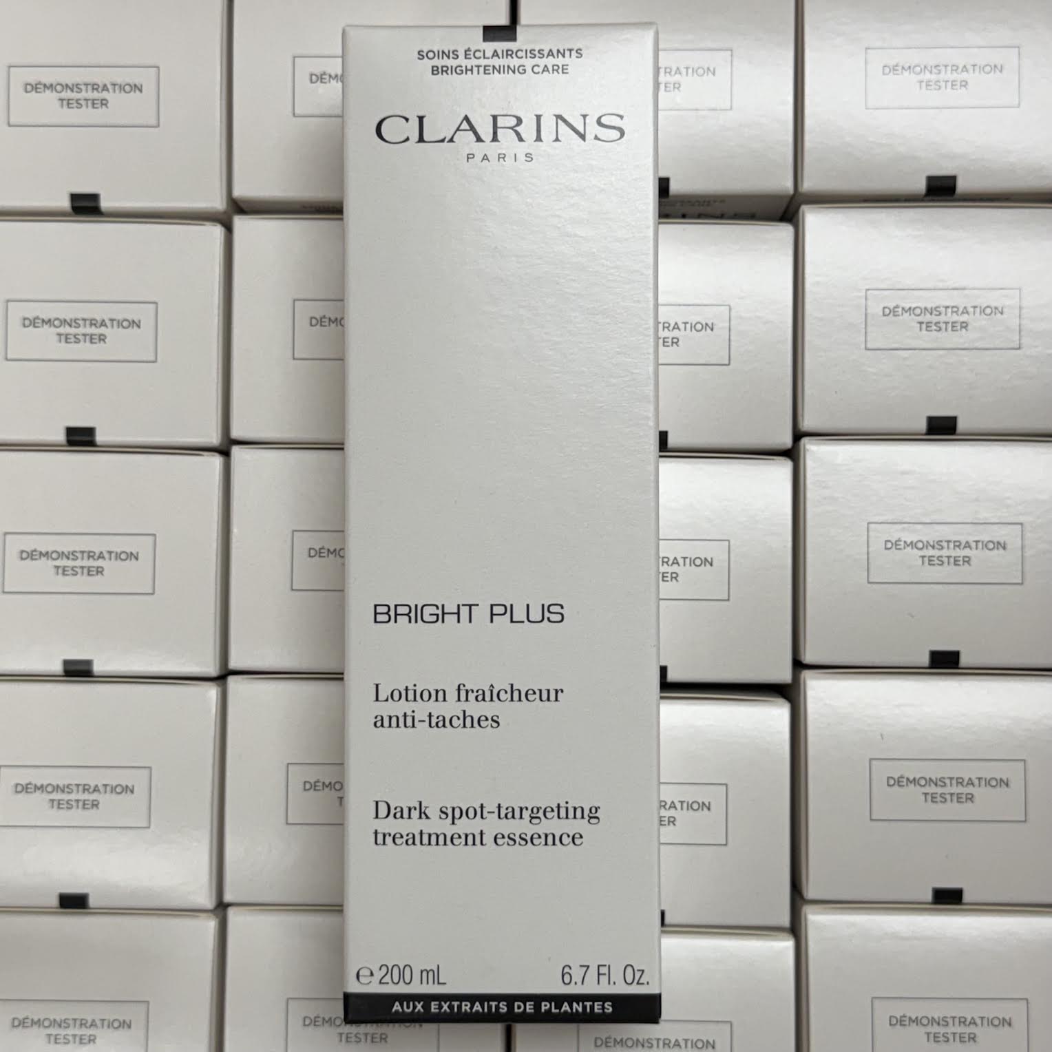 WHOLESALE CLARINS BRIGHT PLUS DARK SPOT-TARGETING TREATMENT ESSENCE TESTER BOX 6.7 OZ - 32 PIECE LOT