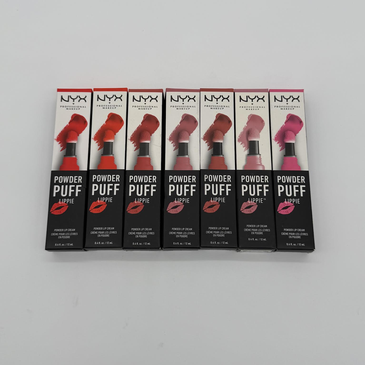 WHOLESALE NYX POWDER PUFF LIPPIE POWDER LIP CREAM 0.4 OZ - ASSORTED COLORS - 100 PIECE LOT