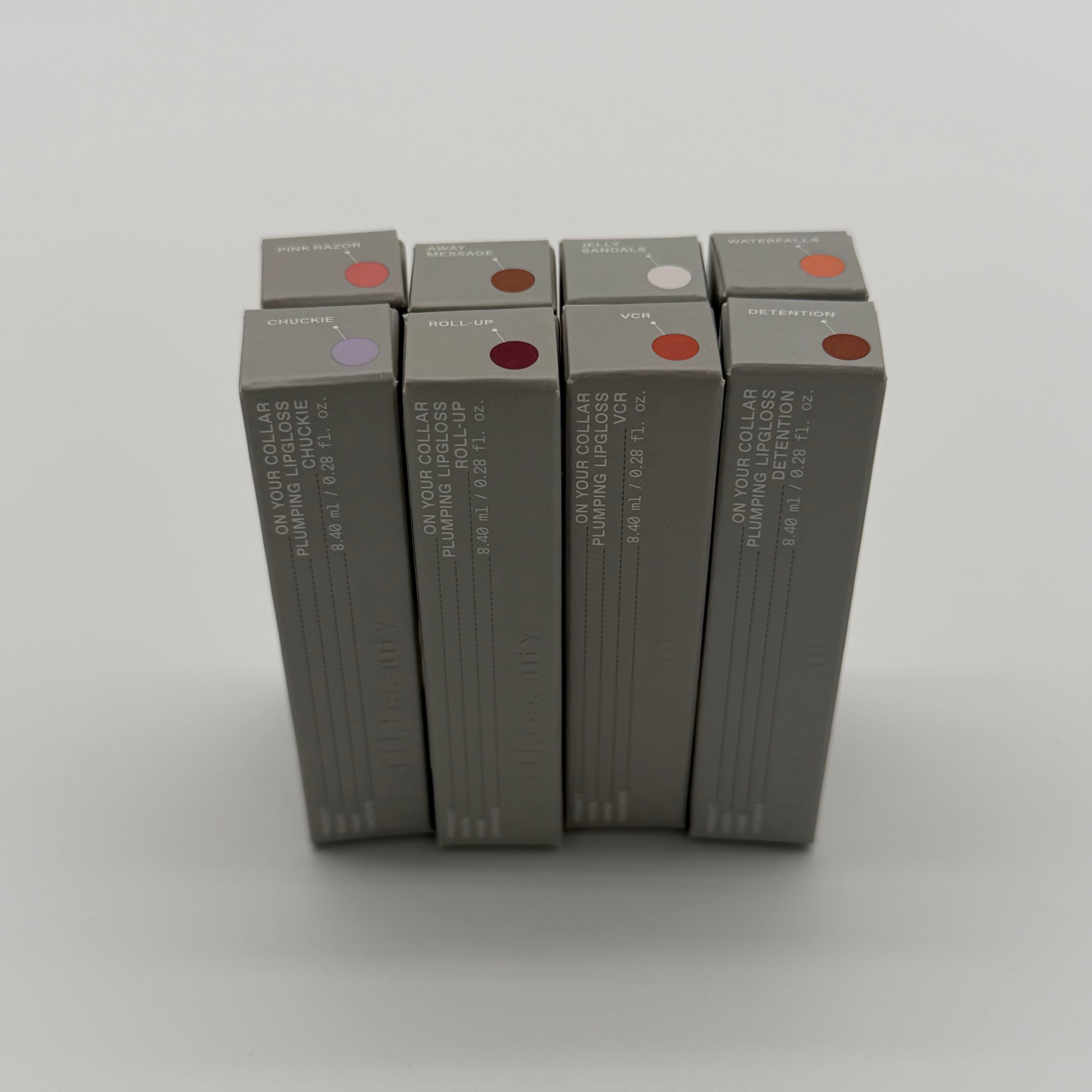 WHOLESALE R.E.M. BEAUTY ON YOUR COLLAR PLUMPING LIPGLOSS PACKAGE #1 - ASSORTED COLORS - 48 PIECE LOT