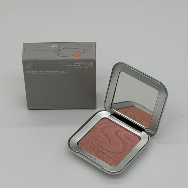 WHOLESALE R.E.M. BEAUTY INTERSTELLAR HIGHLIGHTER TOPPER 0.28 OZ - MISS URANUS - 50 PIECE LOT